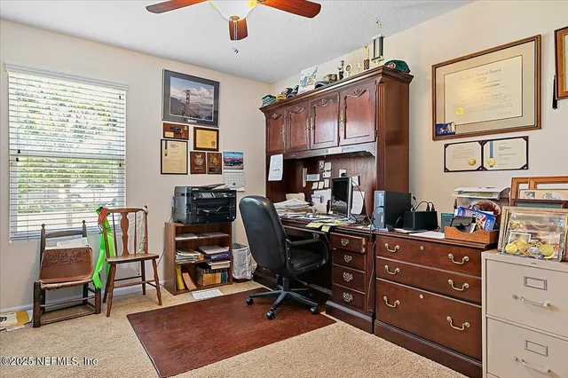 a living room with furniture a flat screen tv and a dresser