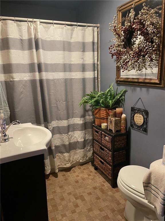 600 Wises Grove Road New Brighton, PA 15066 - Photo 7 of 13 a bathroom with a sink toilet and shower