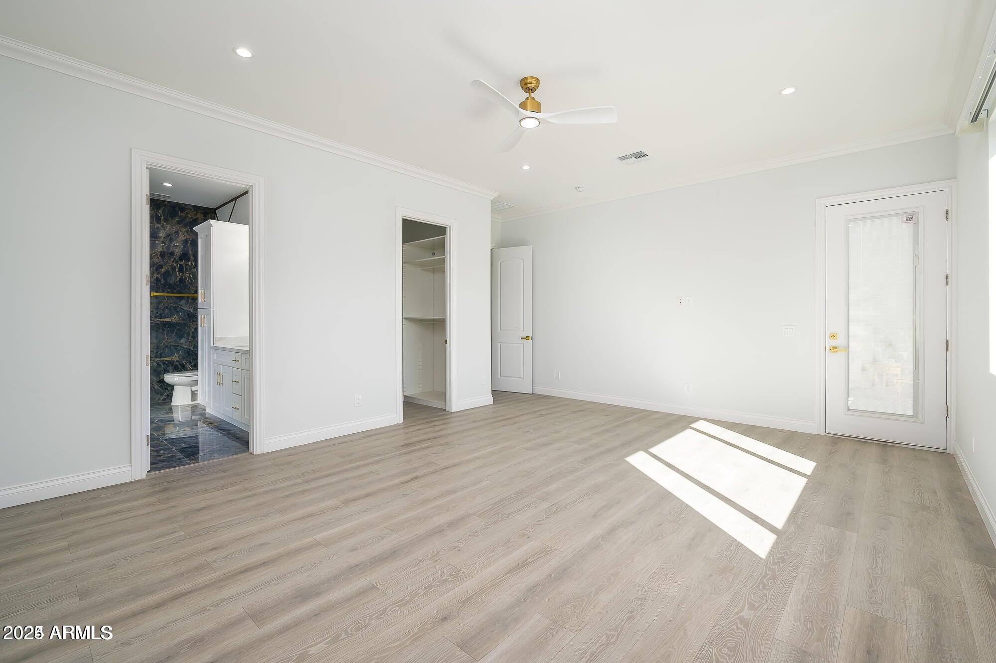 6729 North 13th Street Phoenix, AZ 85014 - Photo 13 of 24 wooden floor in an empty room with a window