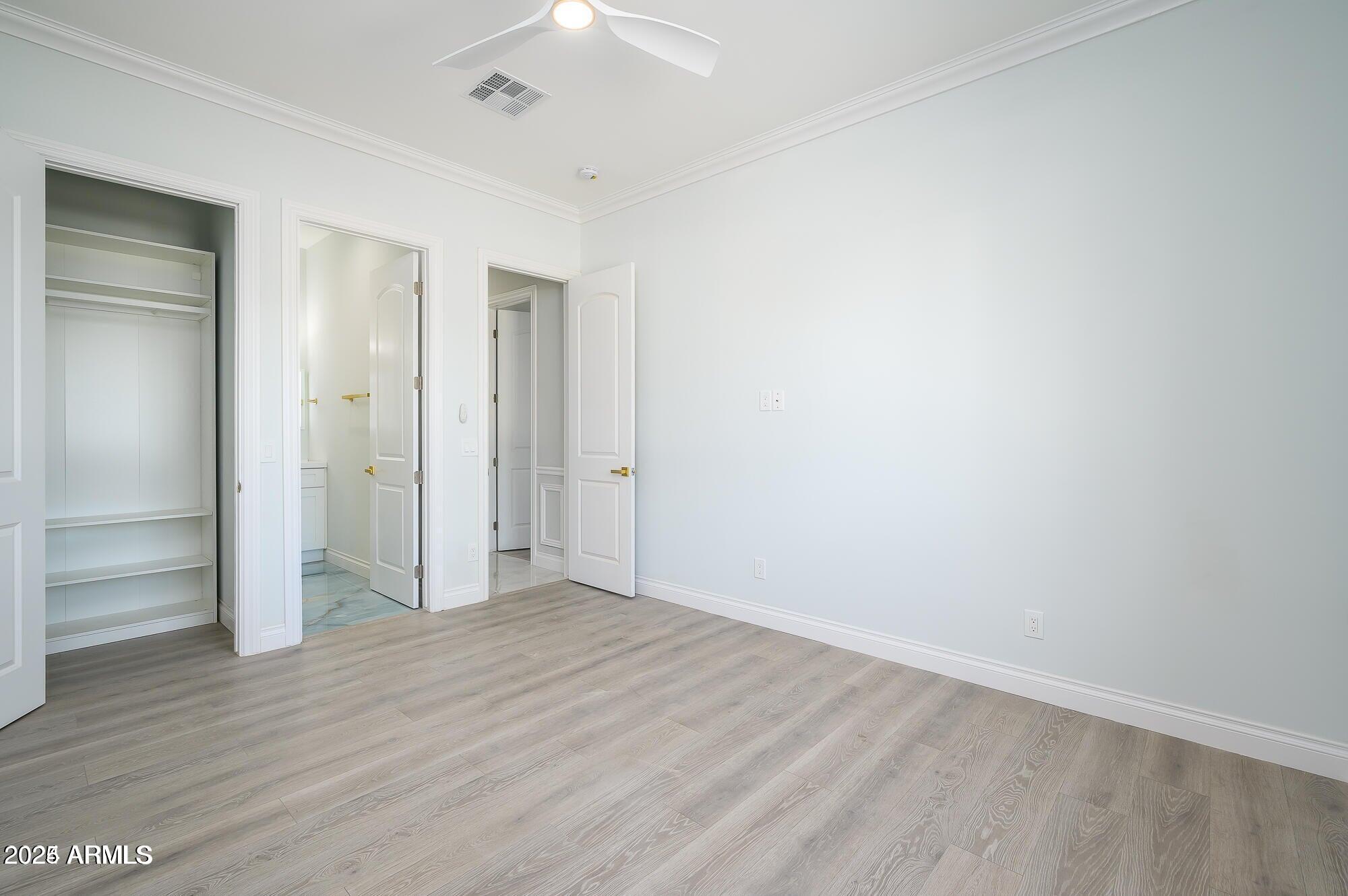 6729 North 13th Street Phoenix, AZ 85014 - Photo 19 of 24 a view of an empty room with wooden floor