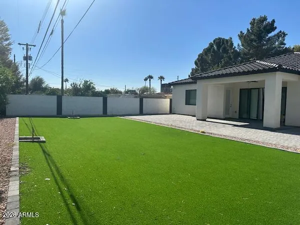a view of a backyard with a garden and plants
