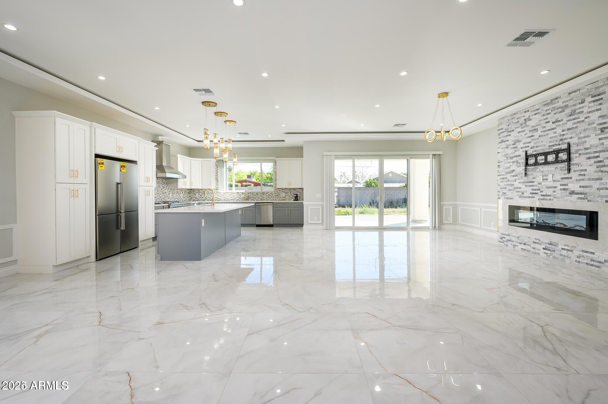 6729 North 13th Street Phoenix, AZ 85014 - Photo 8 of 24 a large white kitchen with a large window