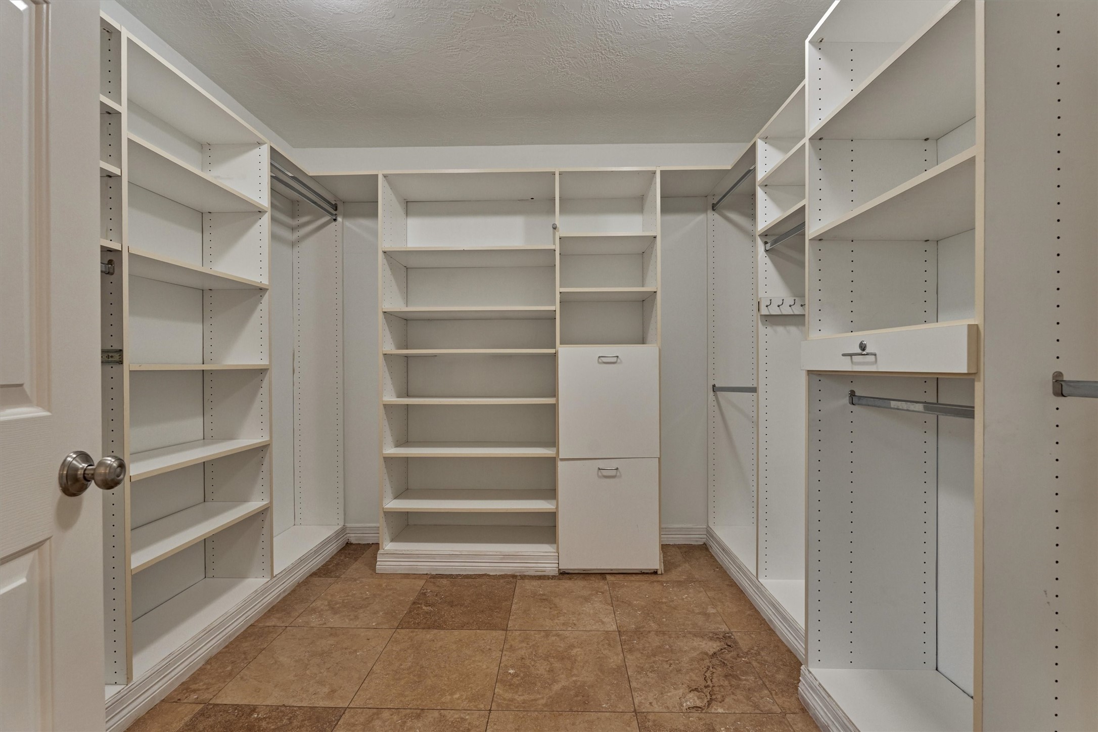 16707 Avenfield Road Tomball, TX 77377 - Photo 24 of 50 a view of walk in closet with empty racks