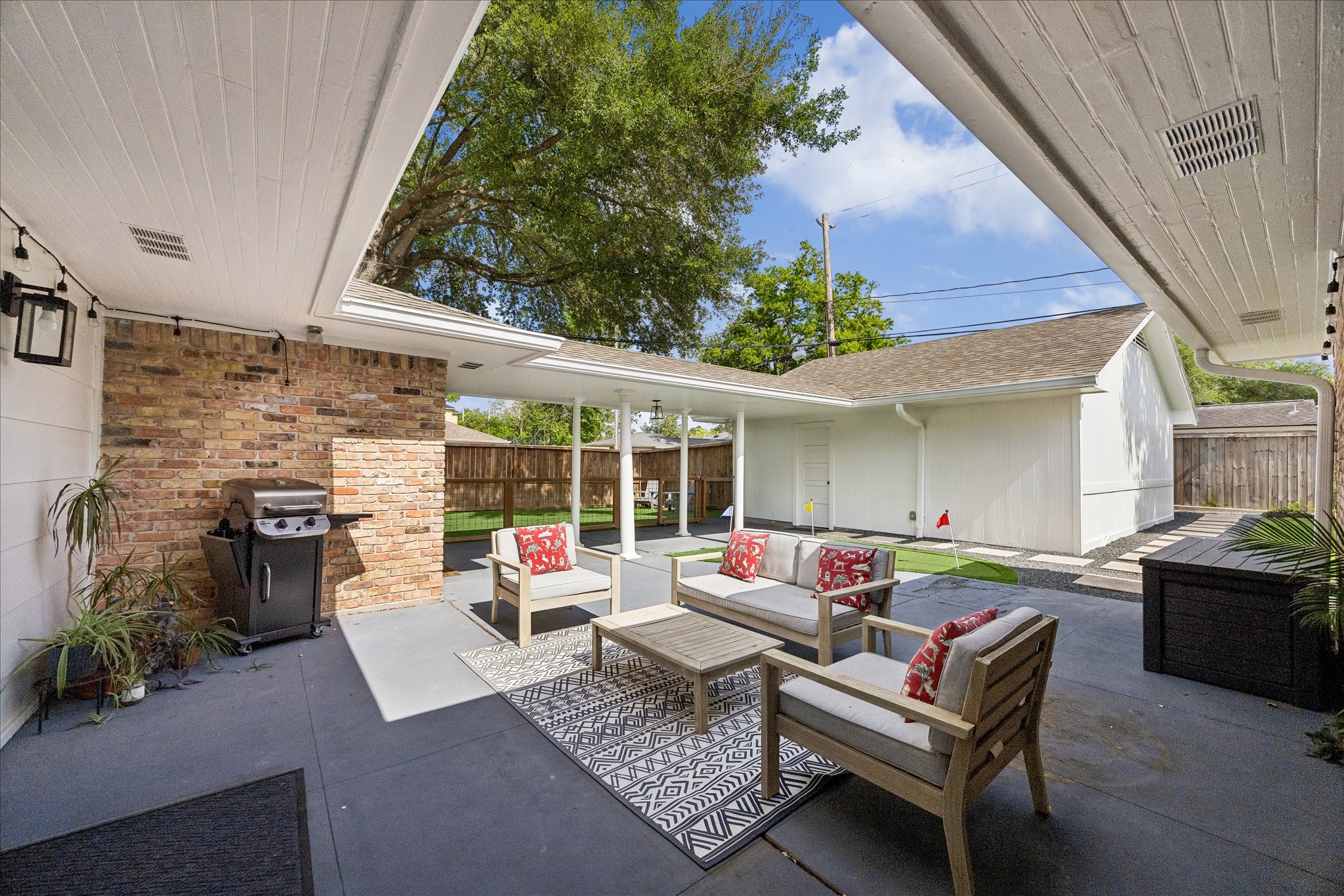 2203 Lamonte Lane Houston, TX 77018 - Photo 17 of 25 a outdoor living space with furniture potted plant and a large window