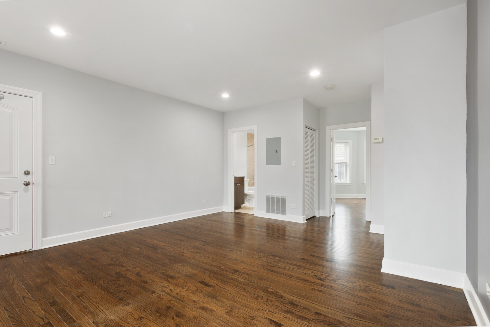 7728 North Ashland Avenue, Unit D2 Chicago, IL 60626 - Photo 5 of 9 a view of an empty room with wooden floor