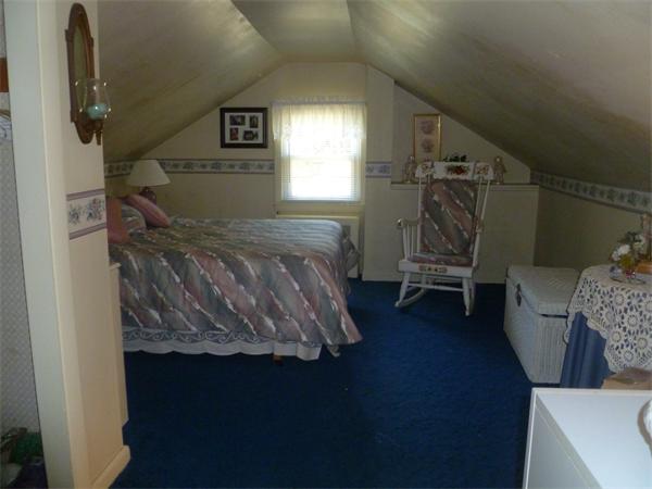 20 Siani Road Leicester, MA 01542 - Photo 20 of 23 a bed room with a bed and a chair