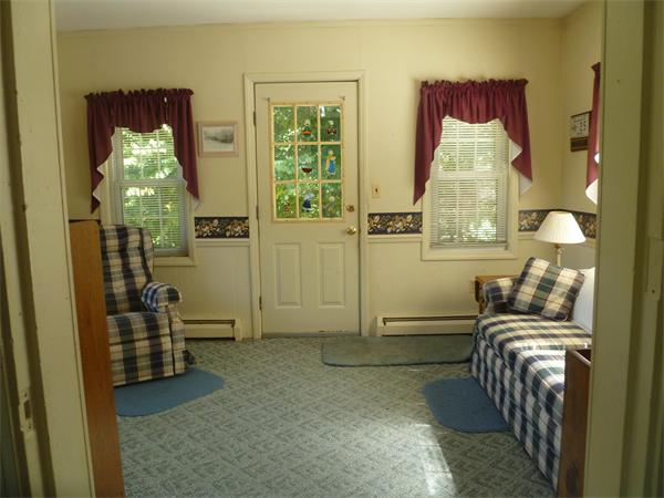 20 Siani Road Leicester, MA 01542 - Photo 4 of 23 a living room with furniture and a chandelier