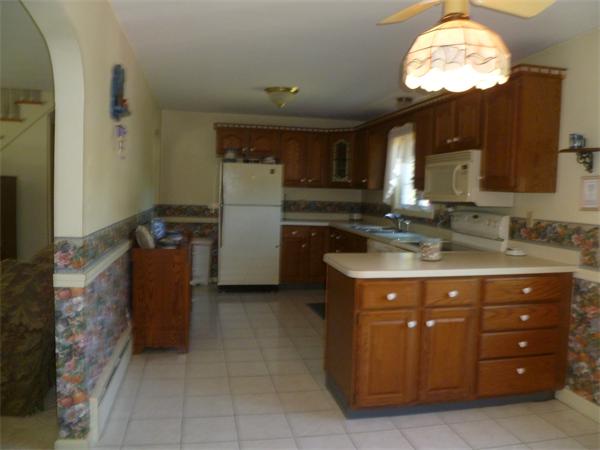 20 Siani Road Leicester, MA 01542 - Photo 5 of 23 a bathroom with a sink a mirror and a light fixture