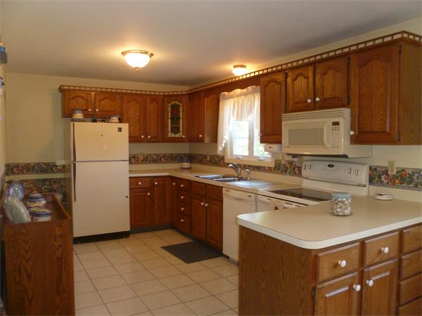 20 Siani Road Leicester, MA 01542 - Photo 6 of 23 a kitchen with a refrigerator and a sink