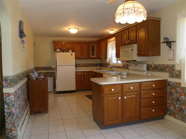 20 Siani Road Leicester, MA 01542 - Photo 7 of 23 a kitchen with a sink cabinets and window