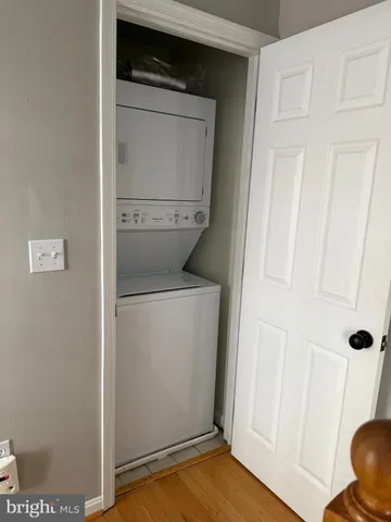 a view of a roof deck with furniture