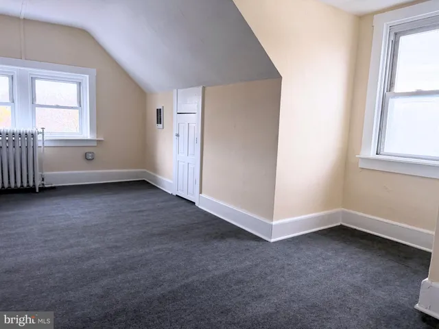 a bathroom with a sink a toilet a mirror and shower