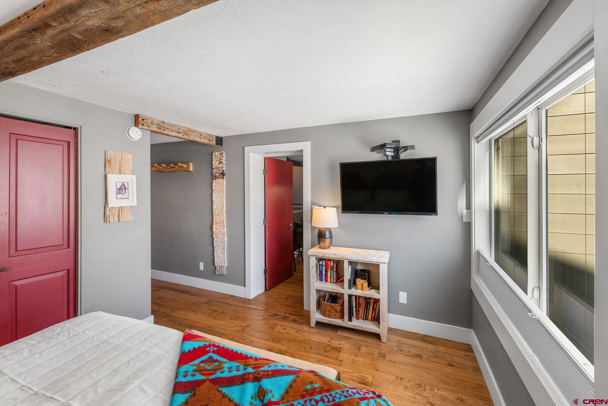 651 Gothic Road, Unit 505 Crested Butte, CO 81225 - Photo 11 of 44 a room with furniture and a flat screen tv