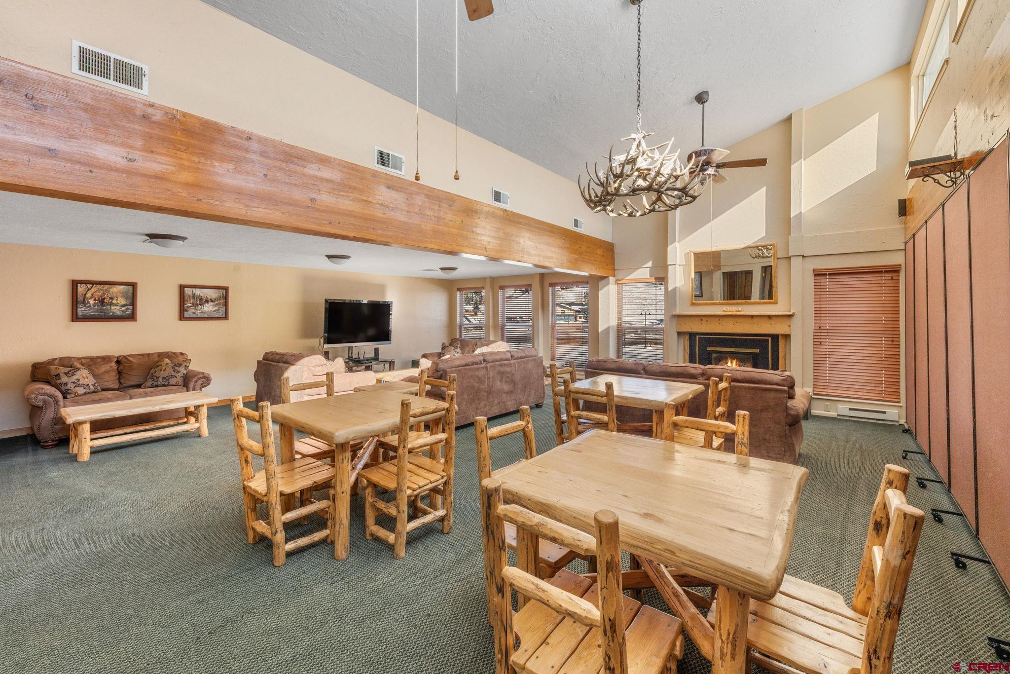 651 Gothic Road, Unit 505 Crested Butte, CO 81225 - Photo 35 of 44 a view of a dining room with furniture window and wooden floor