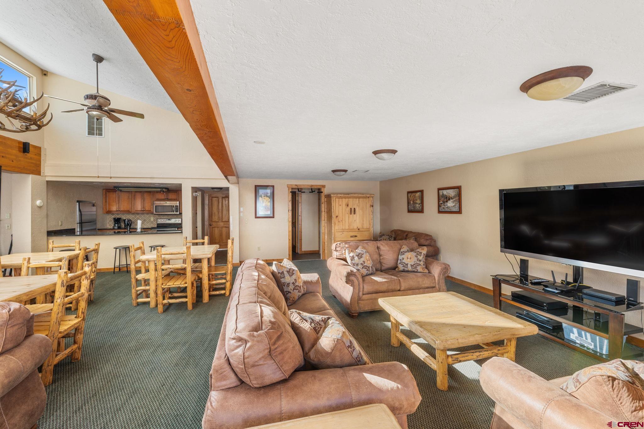 651 Gothic Road, Unit 505 Crested Butte, CO 81225 - Photo 36 of 44 a living room with furniture and a flat screen tv