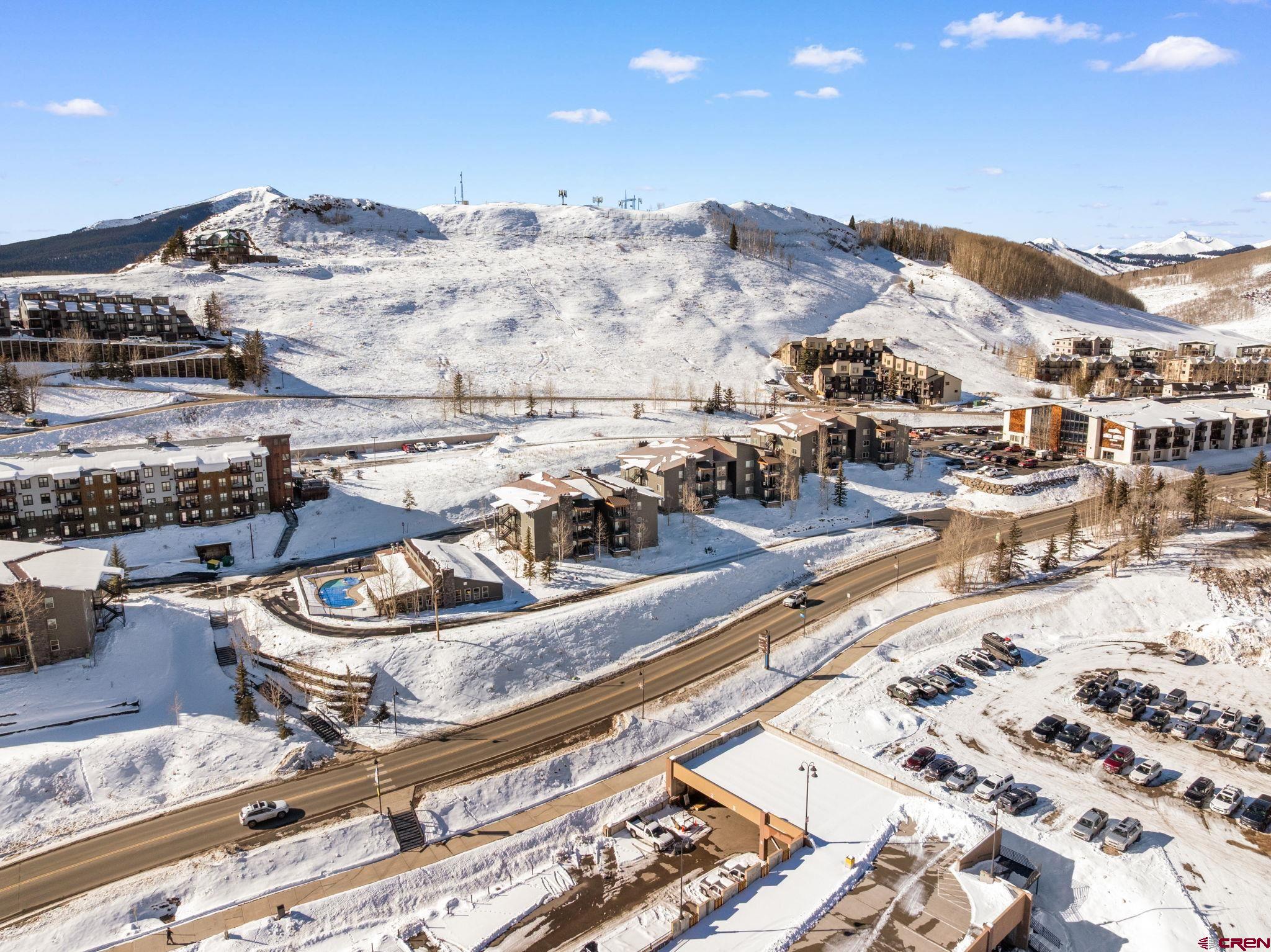 651 Gothic Road, Unit 505 Crested Butte, CO 81225 - Photo 41 of 44 a view of a terrace with chairs and a mountain view