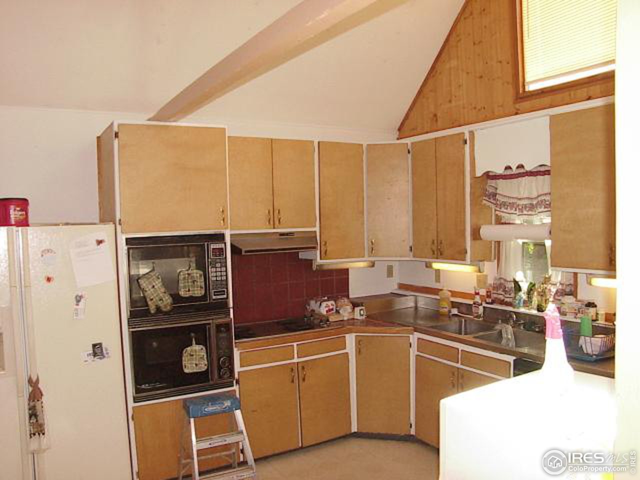 104 Claudius Road Black Hawk, CO 80422 - Photo 6 of 6 a kitchen with a sink and cabinets