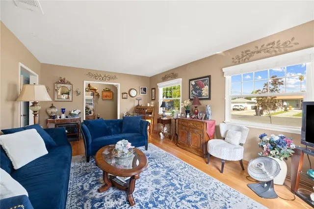 a living room with furniture and a table