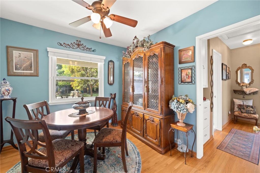 3924 Wayne Court Riverside, CA 92504 - Photo 14 of 31 a view of a dining room and livingroom with furniture wooden floor a chandelier