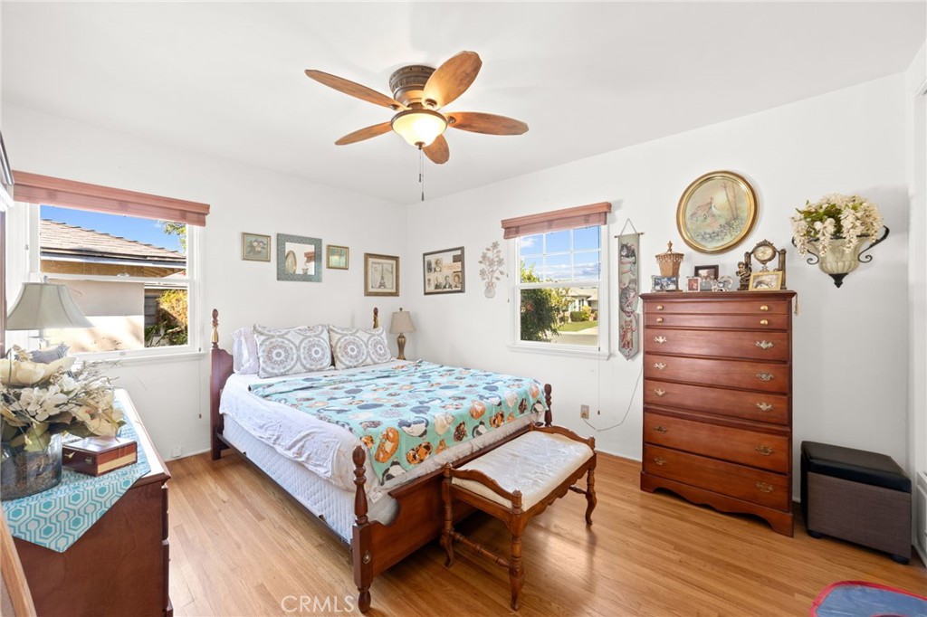 3924 Wayne Court Riverside, CA 92504 - Photo 20 of 31 a bedroom with a bed and a chandelier