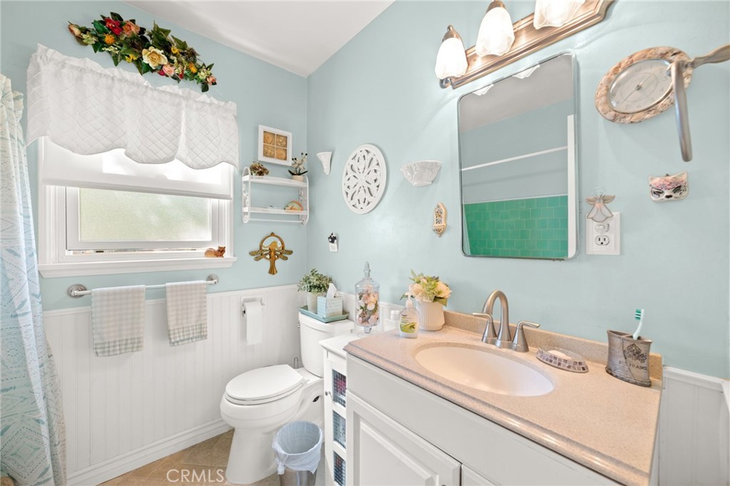 3924 Wayne Court Riverside, CA 92504 - Photo 24 of 31 a bathroom with a sink vanity mirror and toilet