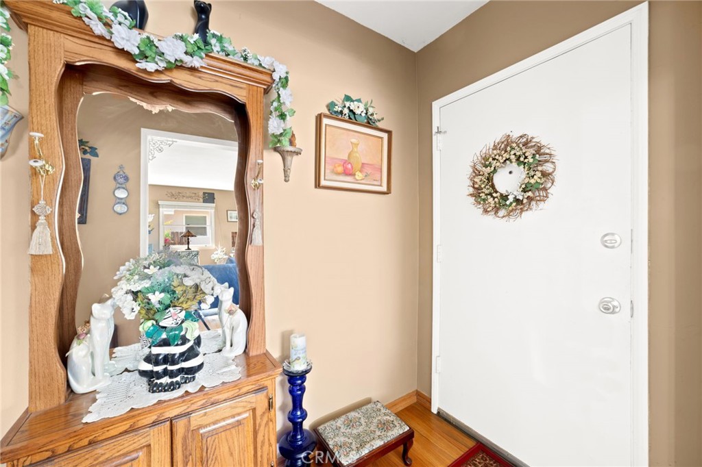 3924 Wayne Court Riverside, CA 92504 - Photo 9 of 31 a view of a hallway with wooden floor and a dining table