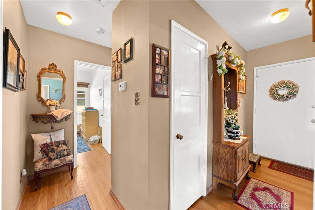 3924 Wayne Court Riverside, CA 92504 - Photo 10 of 31 a view of a hallway with wooden floor and dining room view