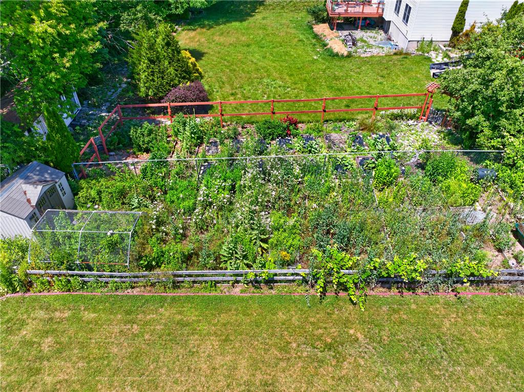 220 Pennbrook Road Stroudsburg, PA 18360 - Photo 58 of 60 An aerial perspective reveals a vibrant, cultivated garden space framed by natural fencing and a shed.