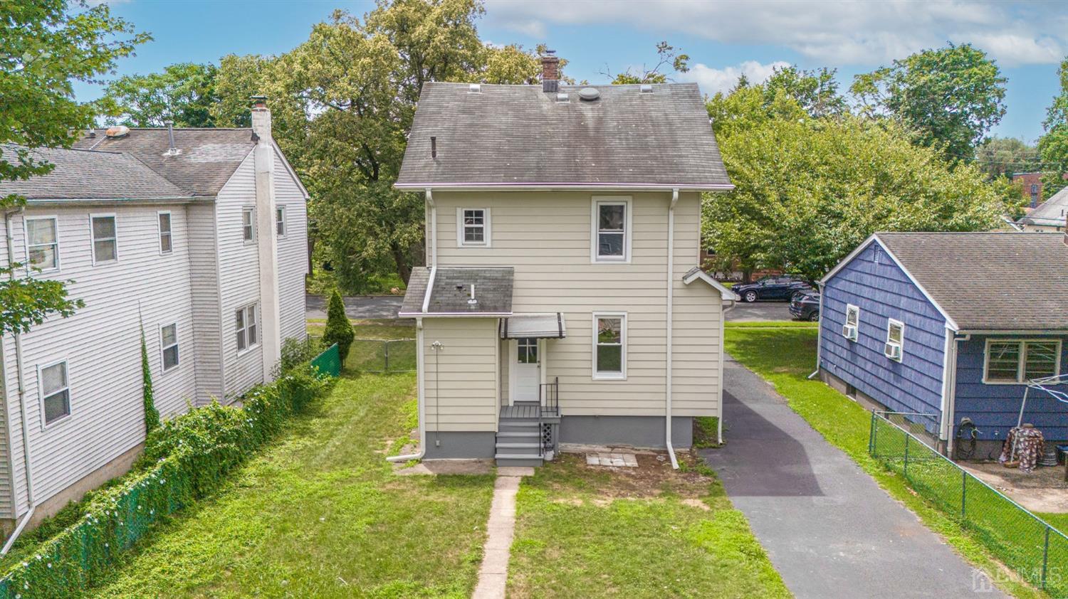 718 Front Street Dunellen, NJ 08812 - Photo 3 of 28 a view of a house with a yard