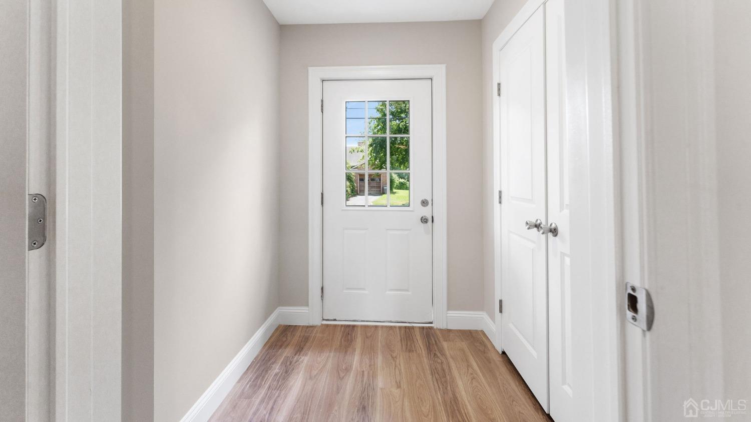 718 Front Street Dunellen, NJ 08812 - Photo 5 of 28 a view of a small space with wooden floor and a window