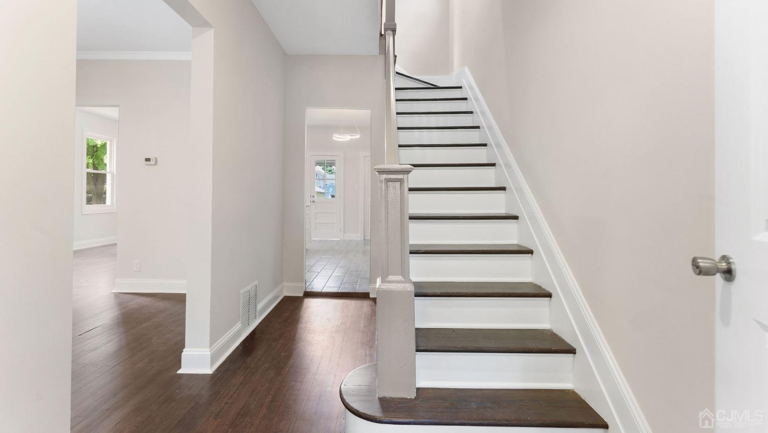 718 Front Street Dunellen, NJ 08812 - Photo 6 of 28 a view of entryway with wooden floor