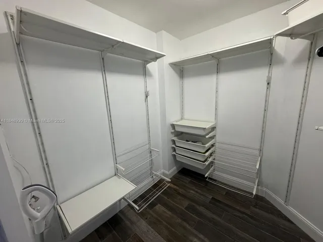 a bathroom with a glass shower door and a sink