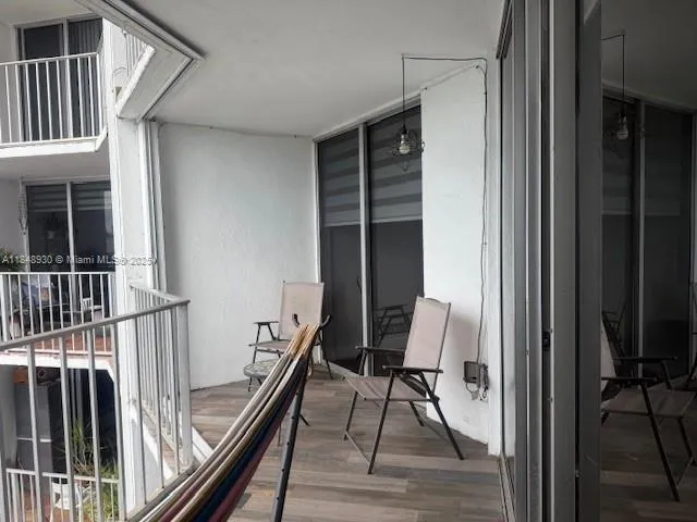 a view of a hallway with seating area