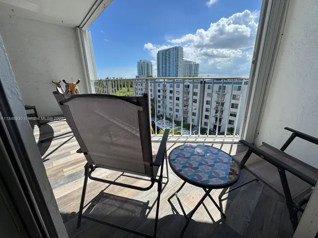 a view of balcony with furniture