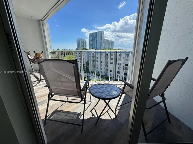 a view of balcony with furniture