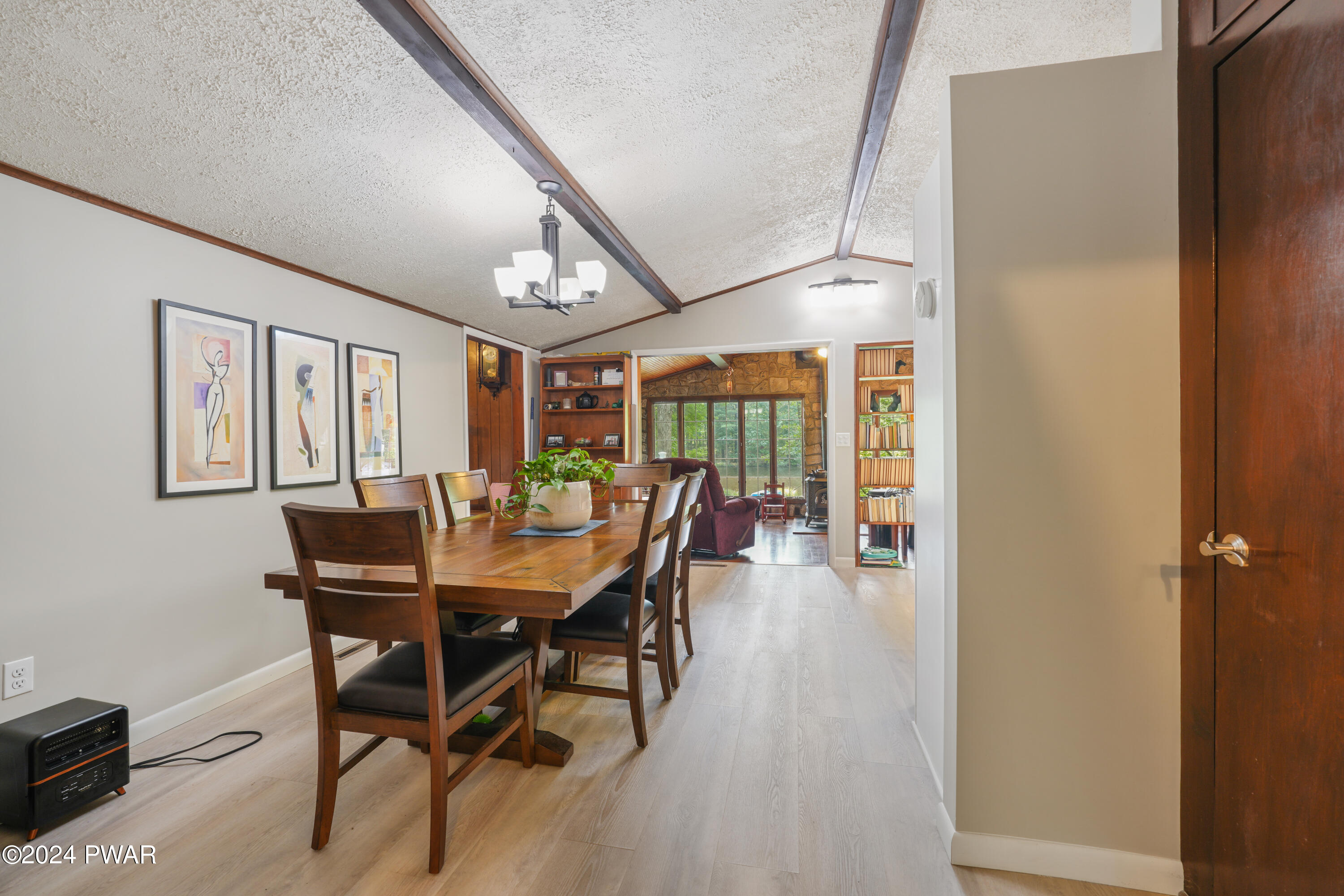 130 Beech Road Dingmans Ferry, PA 18328 - Photo 22 of 31 a view of a dining room with furniture and a floor to ceiling window