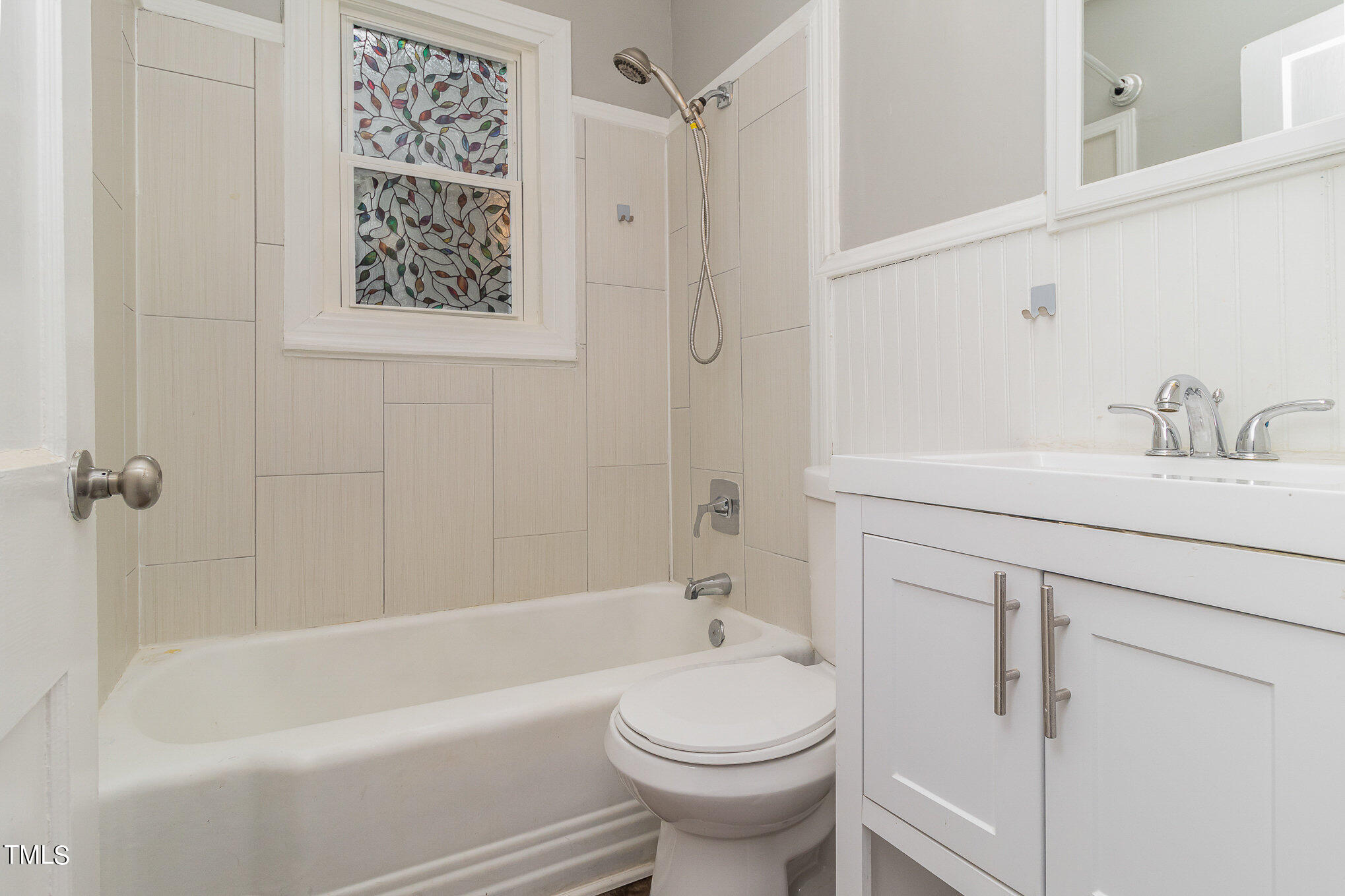 2813 Fowler Avenue Raleigh, NC 27607 - Photo 19 of 30 a bathroom with a sink a toilet and shower