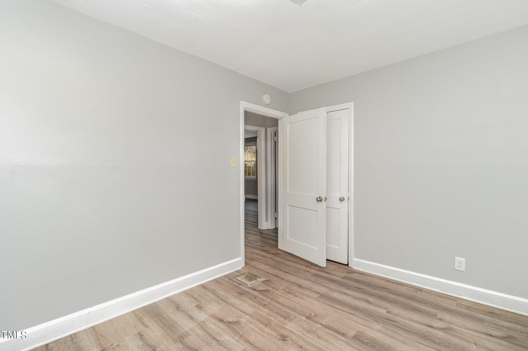 2813 Fowler Avenue Raleigh, NC 27607 - Photo 21 of 30 a view of an empty room with wooden floor