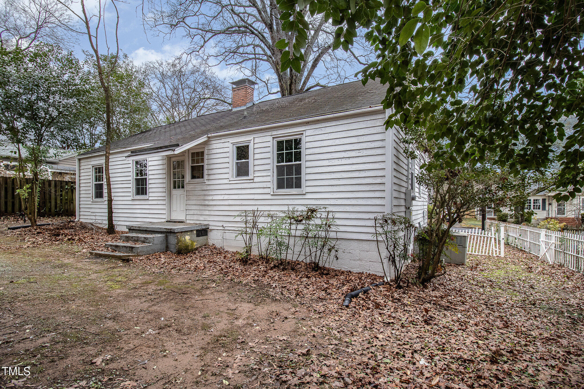 2813 Fowler Avenue Raleigh, NC 27607 - Photo 25 of 30 a backyard of a house with table and chairs