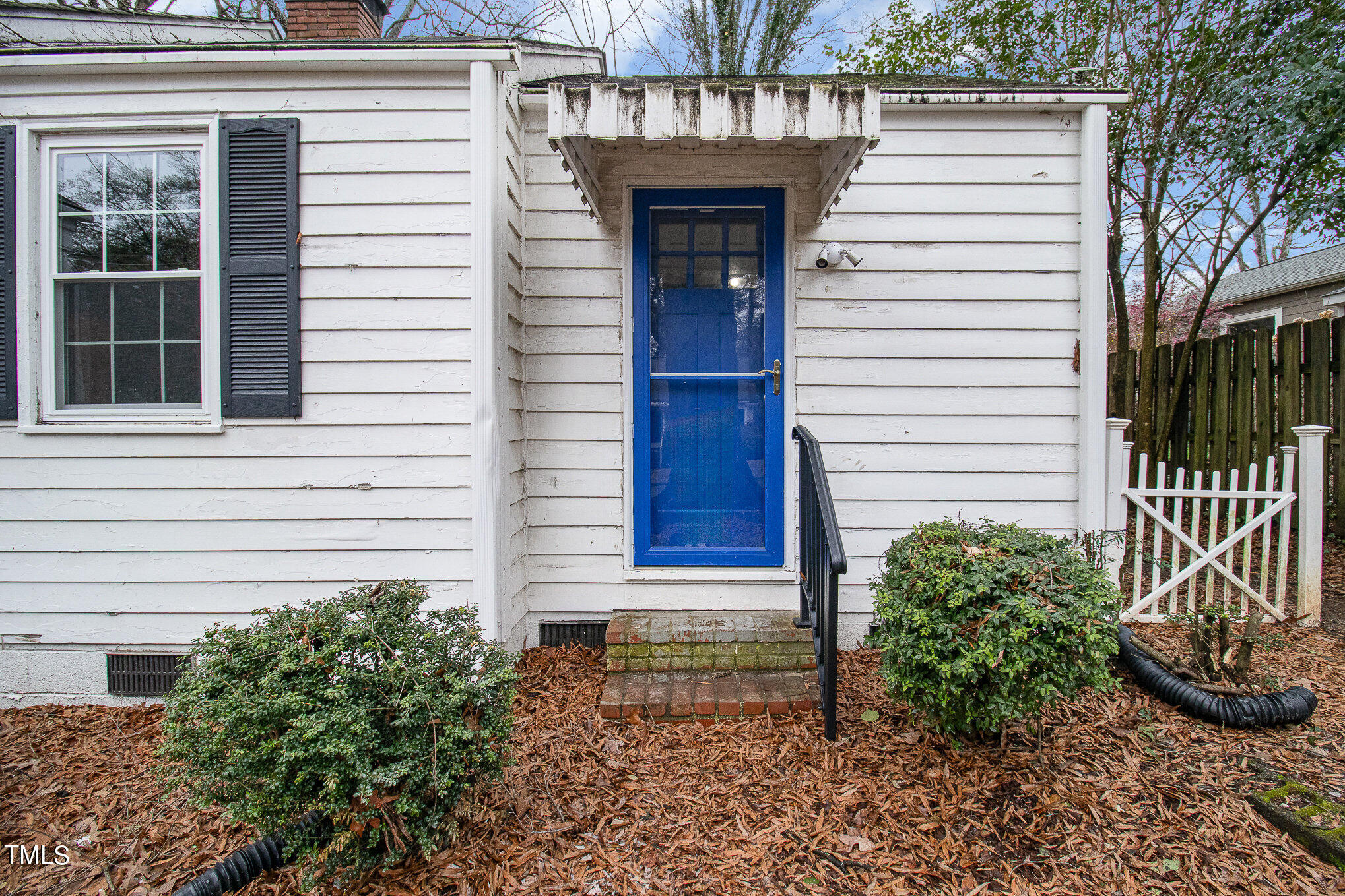 2813 Fowler Avenue Raleigh, NC 27607 - Photo 5 of 30 a view of a house with a small window and plants
