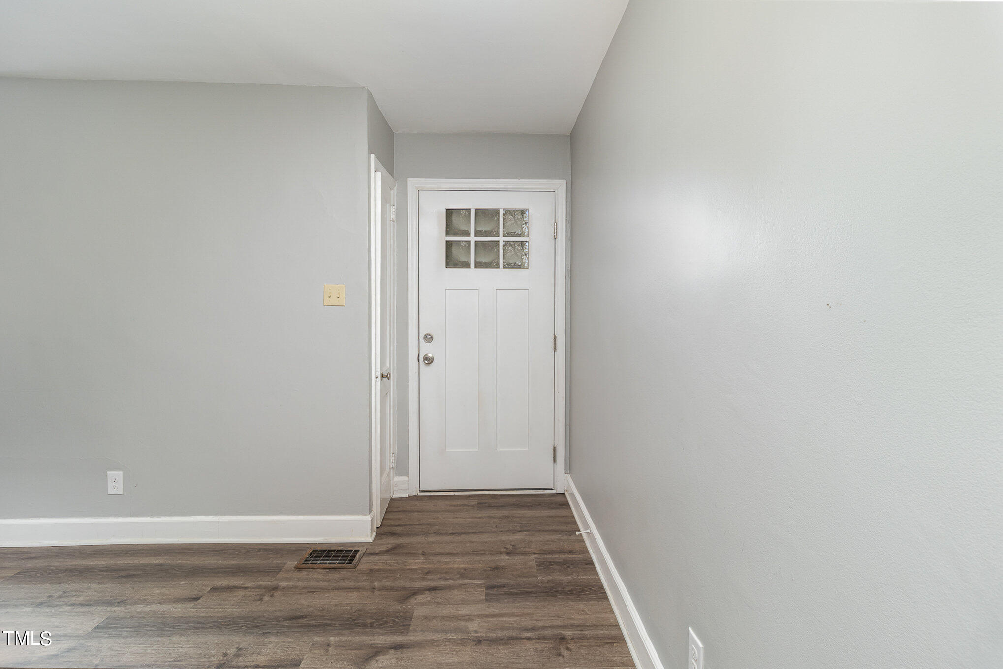 2813 Fowler Avenue Raleigh, NC 27607 - Photo 10 of 30 a view of a hallway with wooden floor