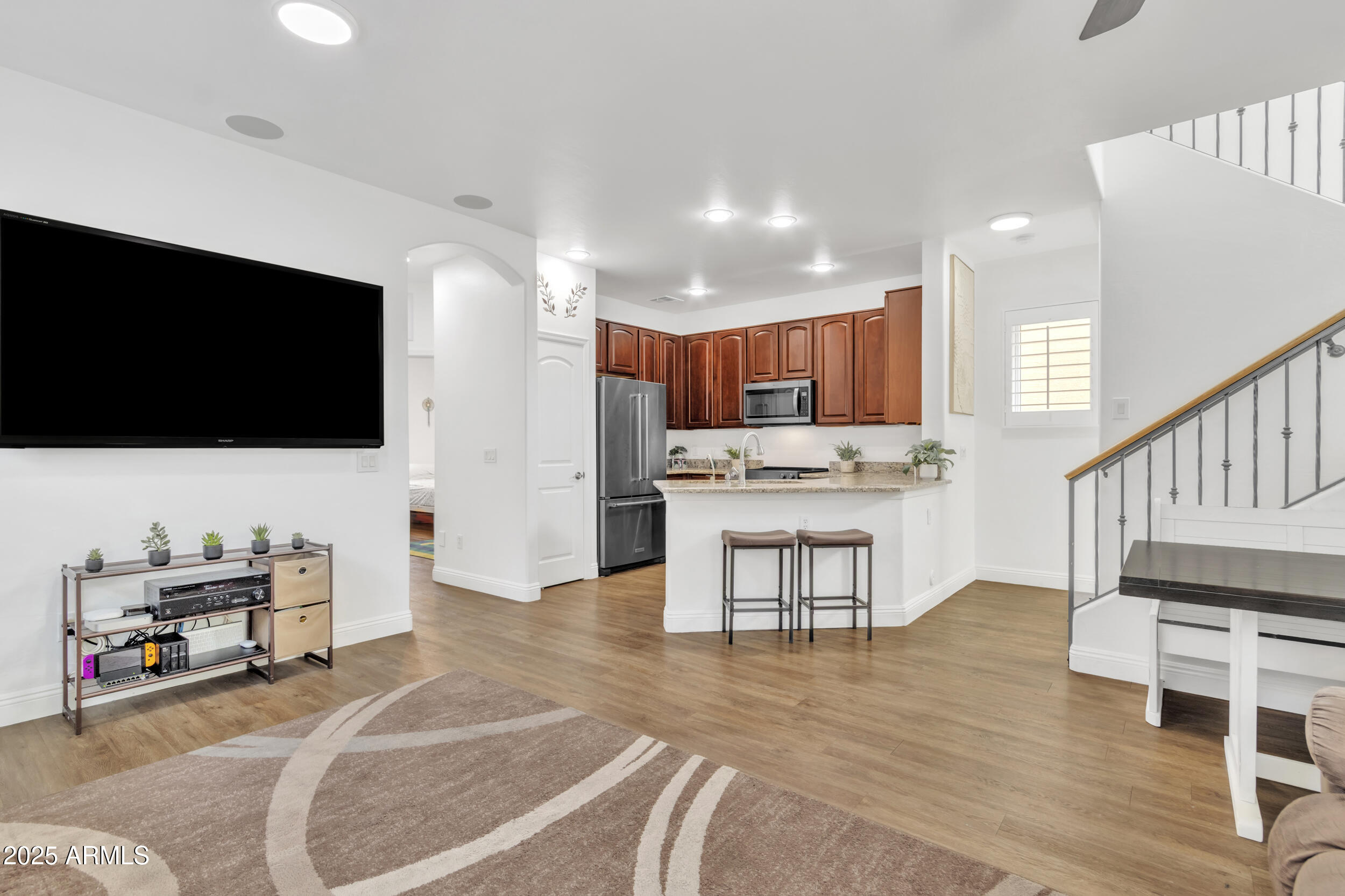 4159 East Jasper Drive Gilbert, AZ 85296 - Photo 9 of 26 a living room with furniture and a flat screen tv