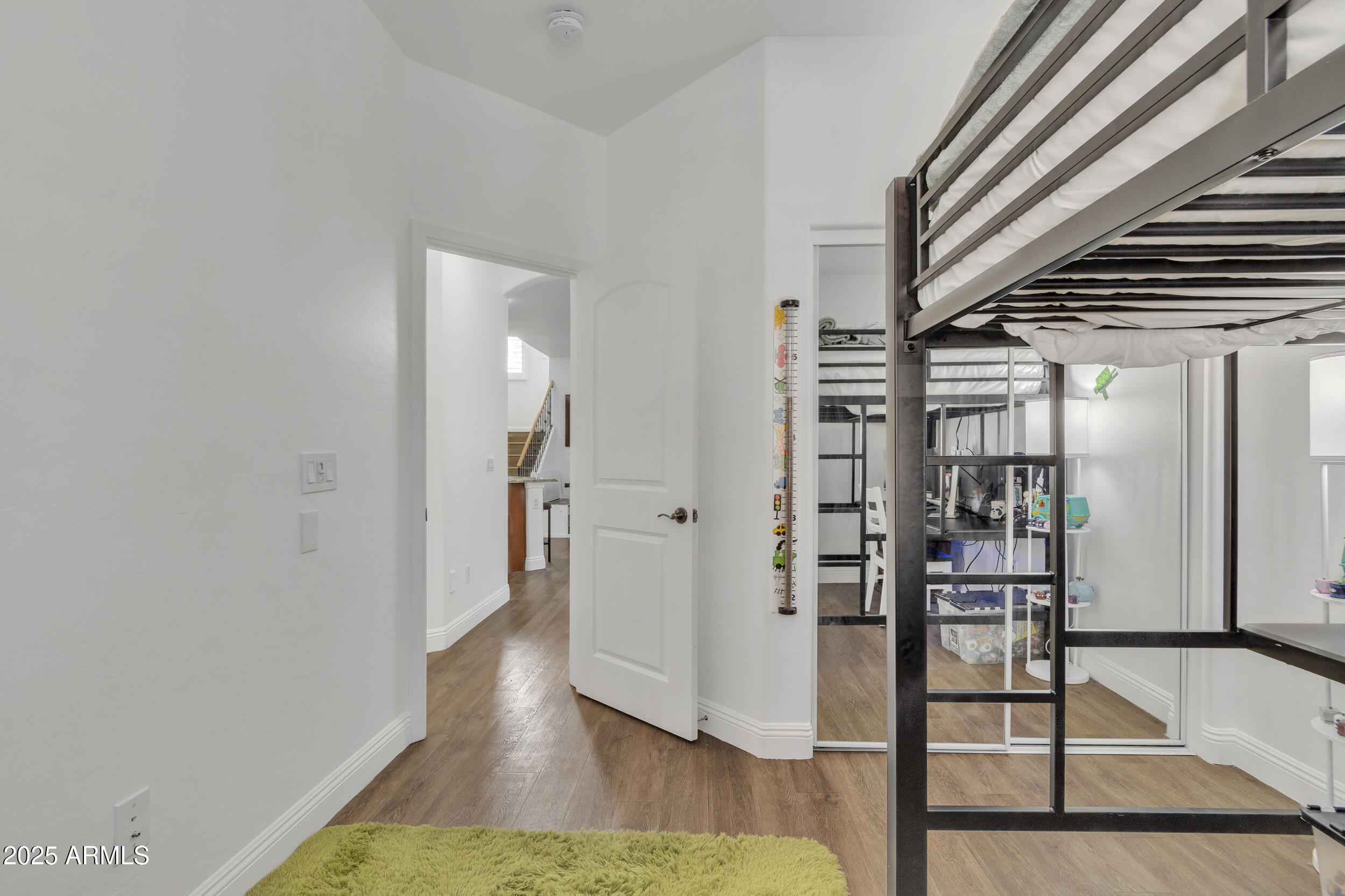 4159 East Jasper Drive Gilbert, AZ 85296 - Photo 13 of 26 a view of a hallway with wooden floor and staircase