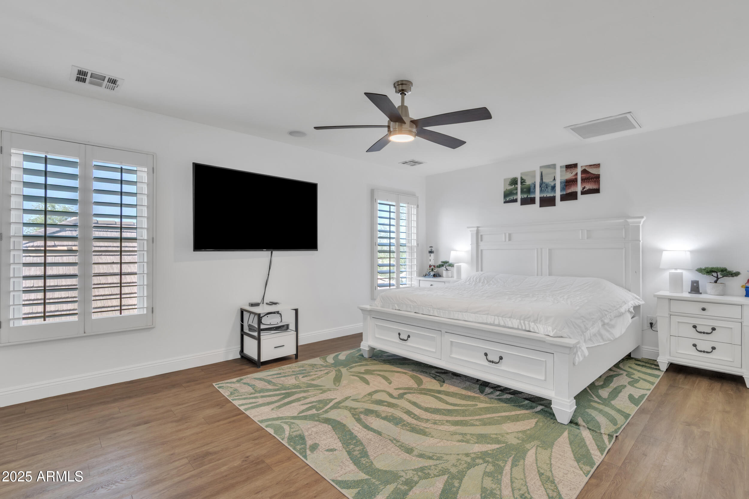 4159 East Jasper Drive Gilbert, AZ 85296 - Photo 16 of 26 a bedroom with a bed tv on table and a window