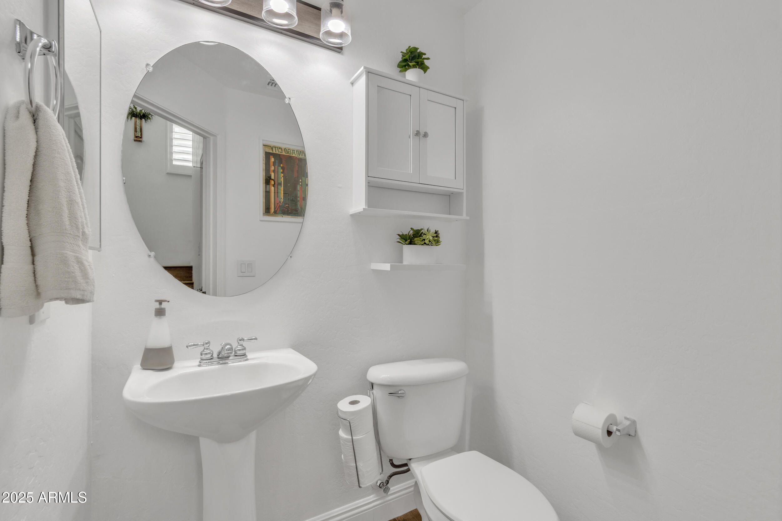 4159 East Jasper Drive Gilbert, AZ 85296 - Photo 22 of 26 a bathroom with a toilet sink and mirror