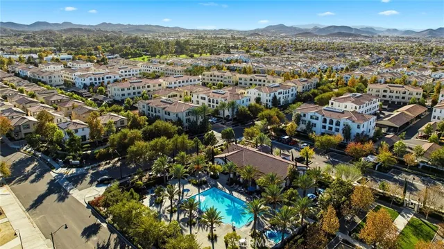 a view of a city with mountains in the background