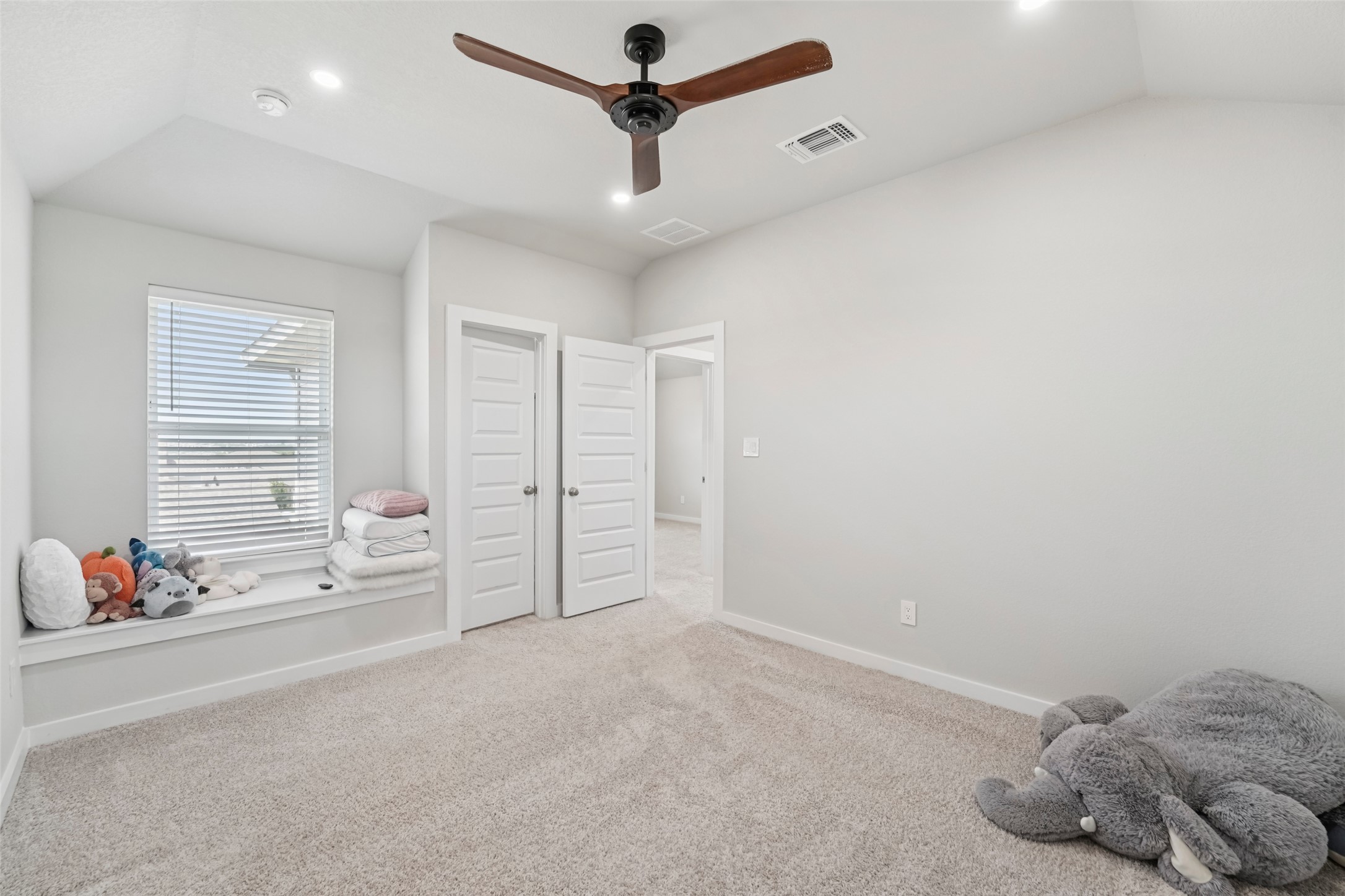 1108 Sweetspire Street Leander, TX 78641 - Photo 29 of 39 Unfurnished bedroom with carpet floors, vaulted ceiling, recessed lighting, and ceiling fan
