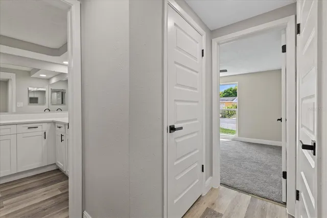 a bathroom with a shower and a sink