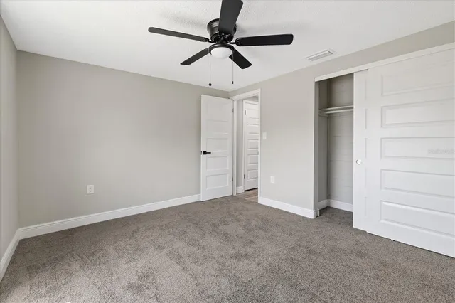 a view of a livingroom with a ceiling fan