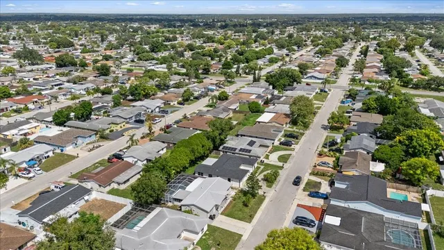 an aerial view of residential houses with outdoor space